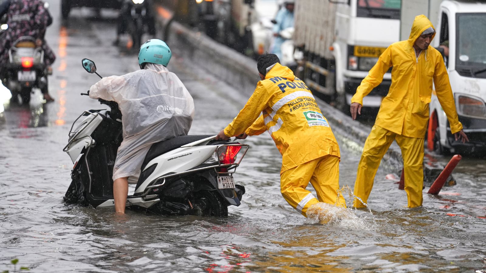 Mumbai rains: Heavy downpour disrupts trains, floods roads a day after monsoon arrives