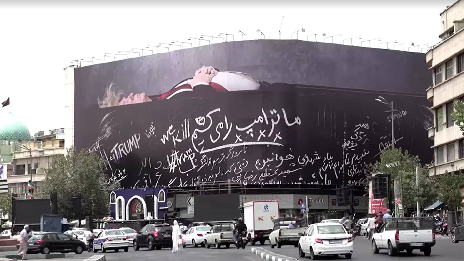Billboard in Tehran depicts Trump in coffin as Iran and US widen attacks