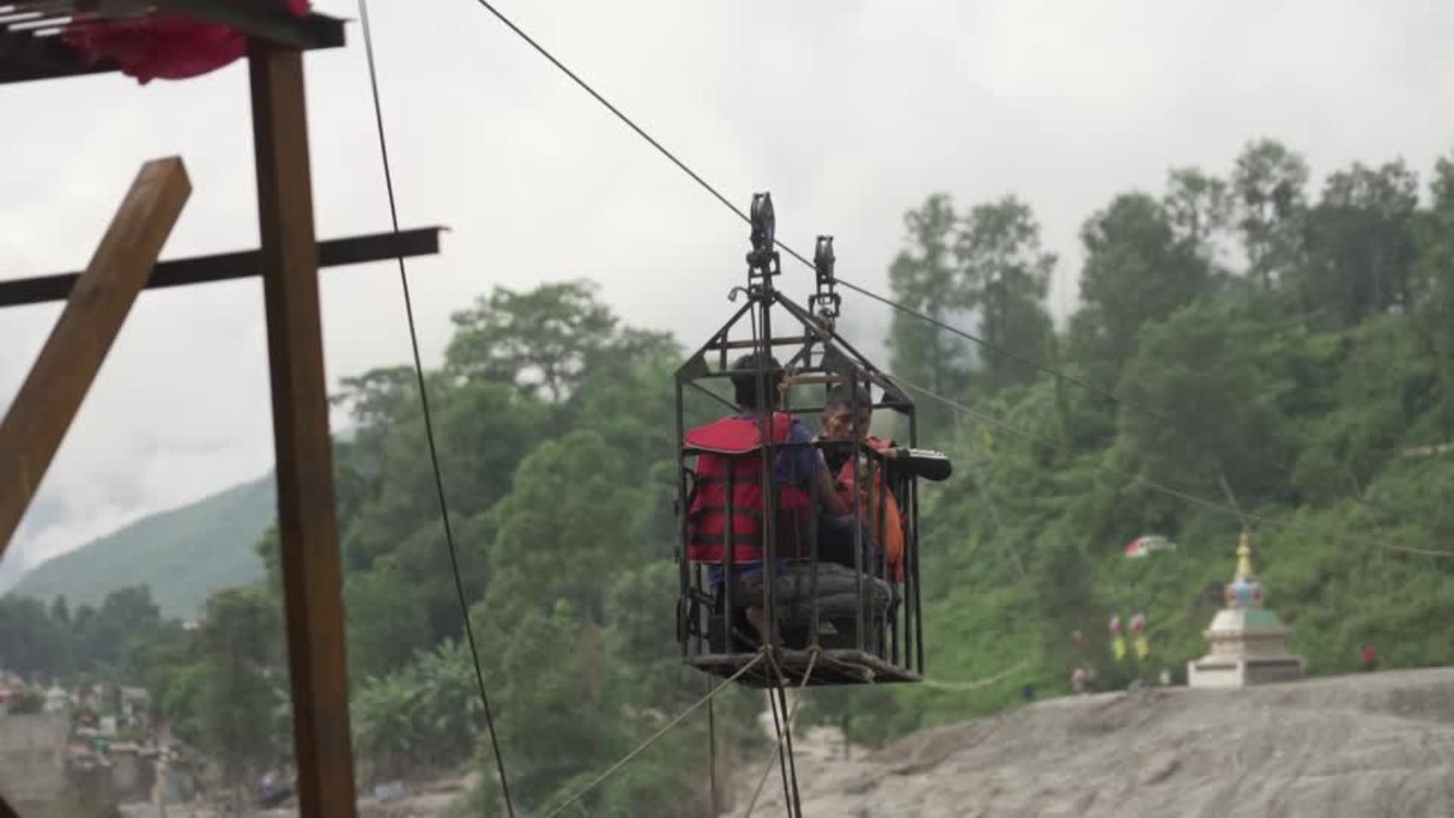 Nepal villagers turn to makeshift zipline to cross raging river