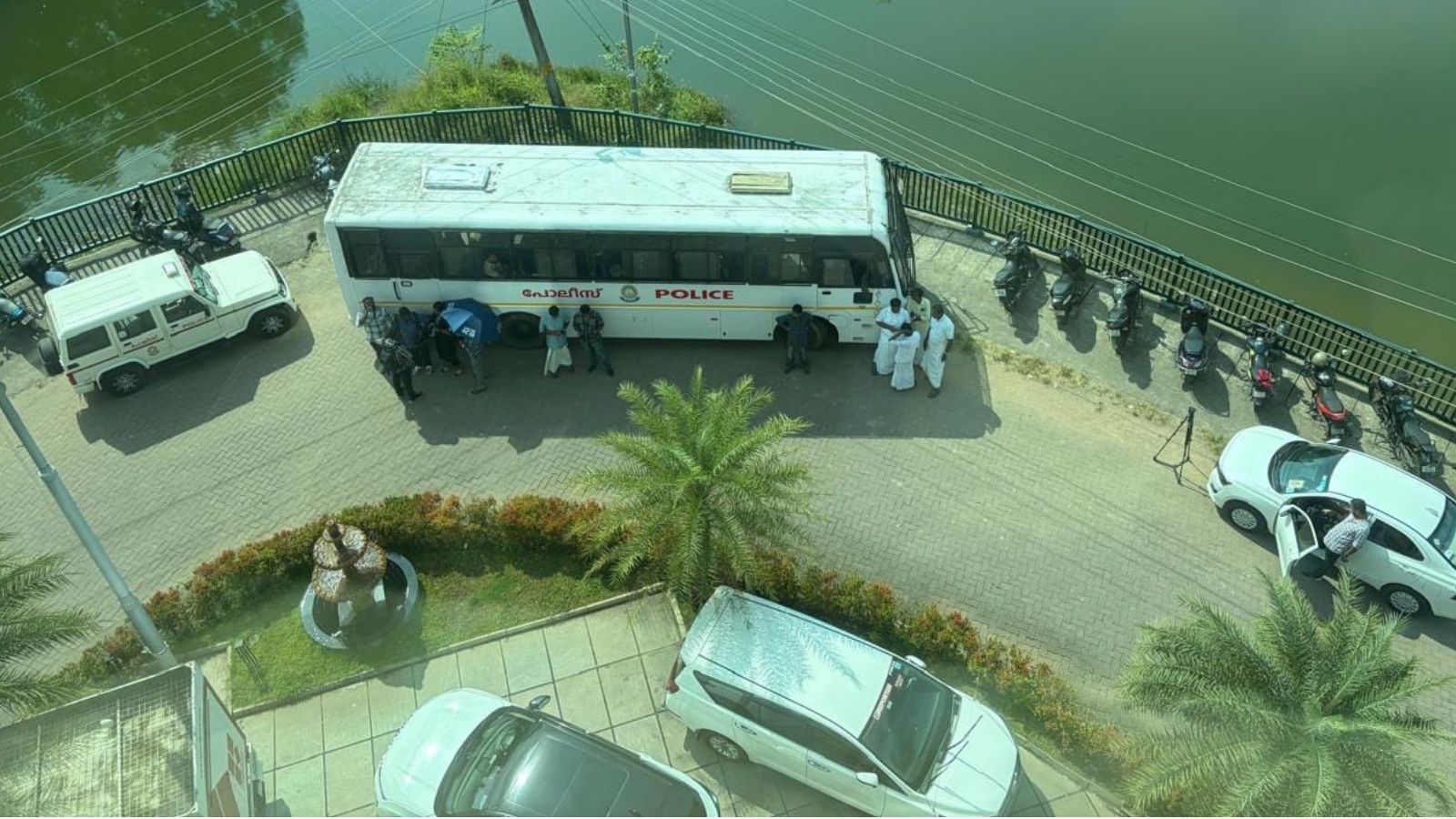 Police vehicles outside the Reporter Broadcasting Company office in Kochi following a police inspection at the news desk. Photo: Reporter TV
