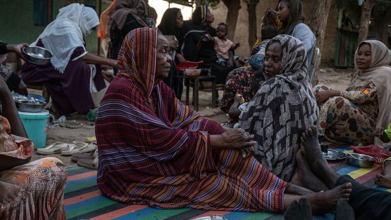 Women and children who have been displaced by conflict in Sudan rest at a former school. Photo: un.org