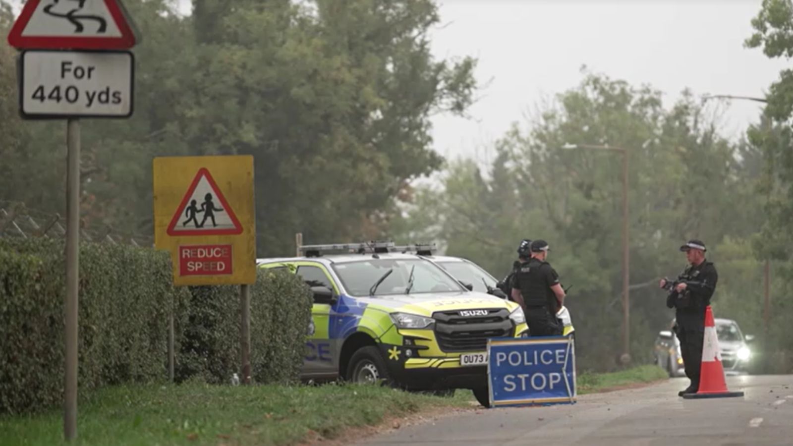 Police stand guard near the RAF Fairford in Gloucestershire, England. Photo: Screengrab/Reuters