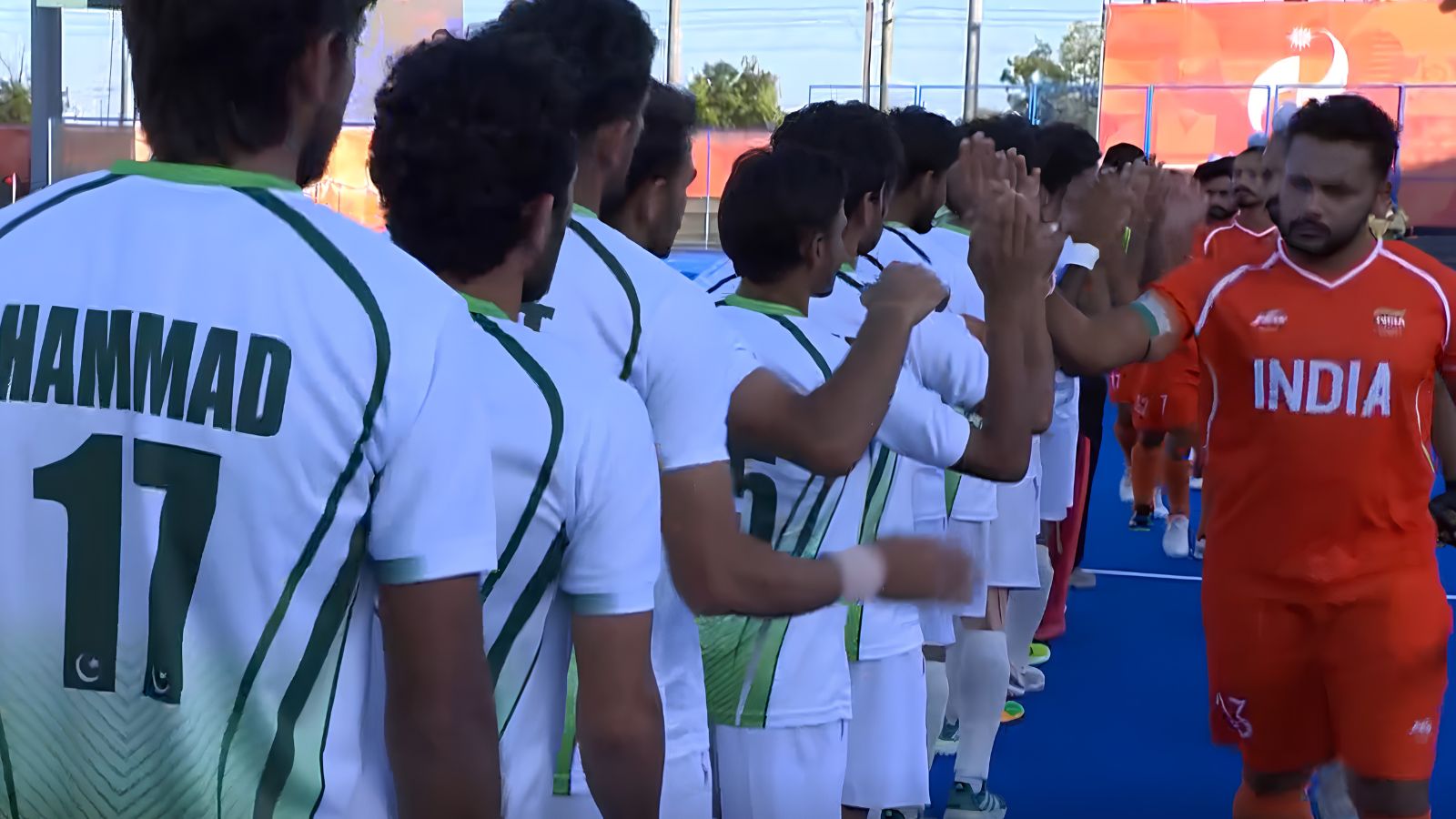 India and Pakistan hockey players greet each other before their semifinal match of the Asian Games in Japan. AI-enhanced image: Screengrab/@SonySports