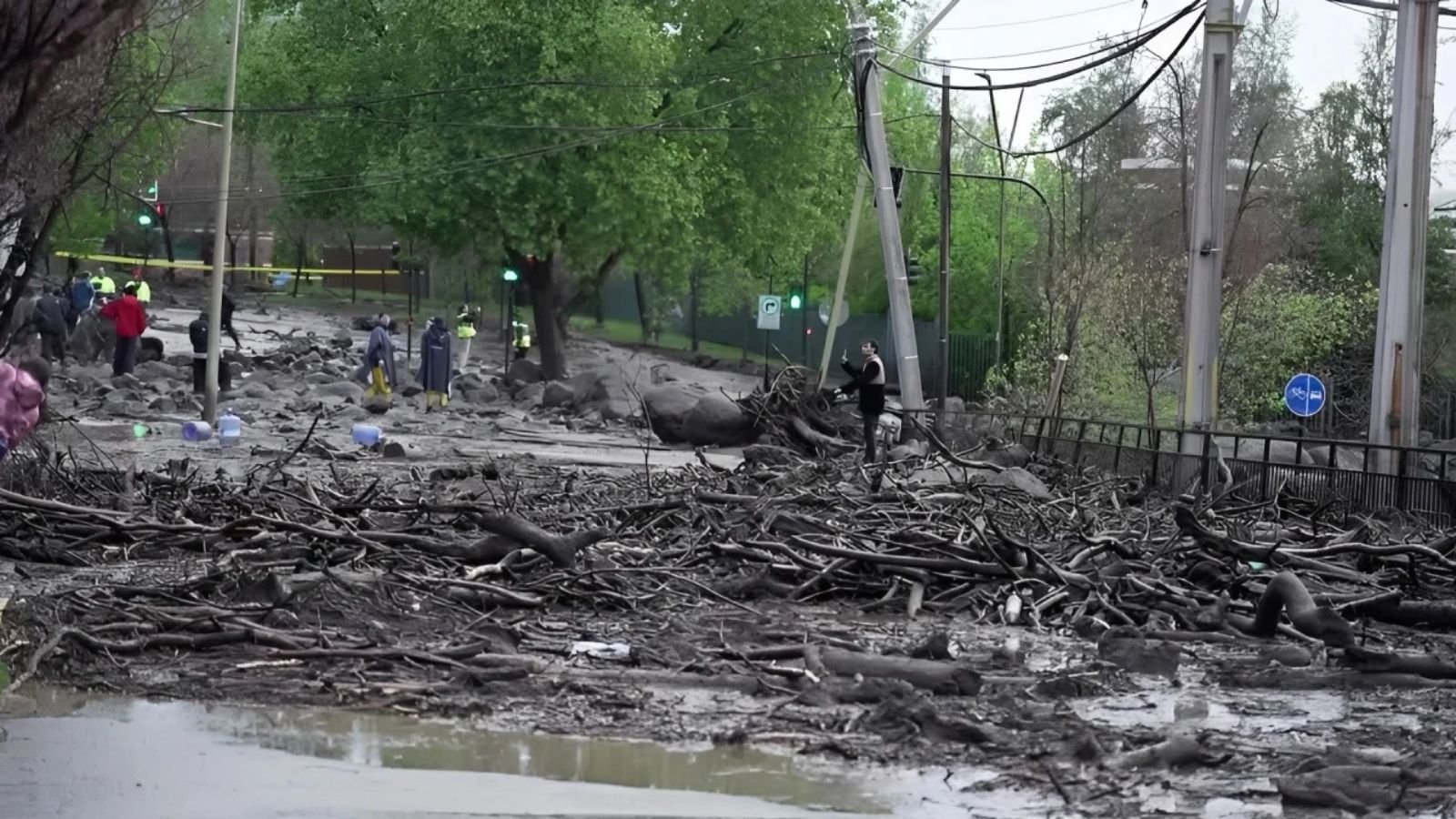 Flash floods inundate Santiago streets, sweeping away cars and buses