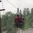Nepal villagers turn to makeshift zipline to cross raging river