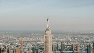 Two people hang banner about 'the power of love' on Empire State Building antenna