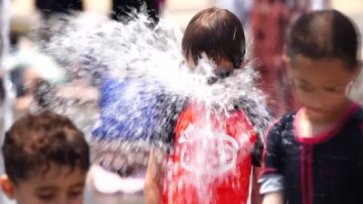 "It's boiling hot," people in Iran, Jerusalem seek watery refuge from heatwave