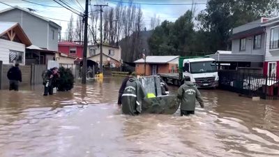 Heavy rains kill two in Chile, trigger floods and massive sinkhole